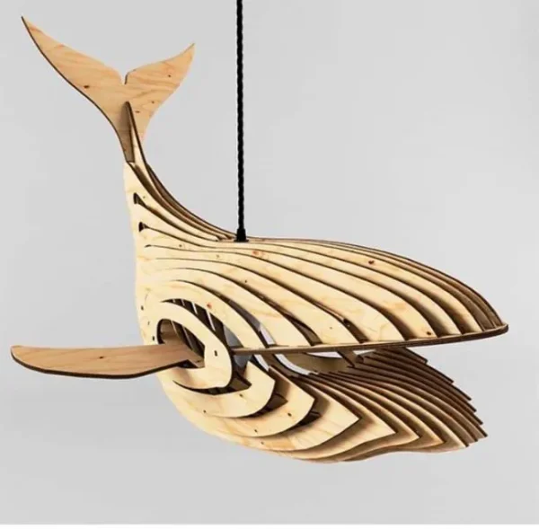Wooden pendant light in the shape of a whale, viewed from the side