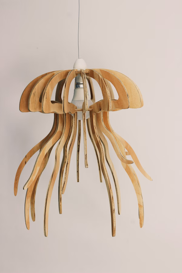Jellyfish-inspired wooden pendant light with fluid, organic curves, suspended against a minimalist beige background