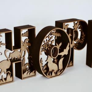 Laser-cut 3D wooden letters spelling "HOPE" with intricate animal and nature silhouettes inside each letter