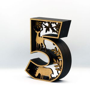 Wooden number 5 sculpture with deer, elephant, and forest scene in laser-cut layered design