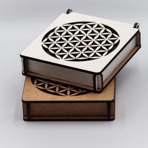 Stacked MDF laser-cut gift boxes featuring the Flower of Life pattern