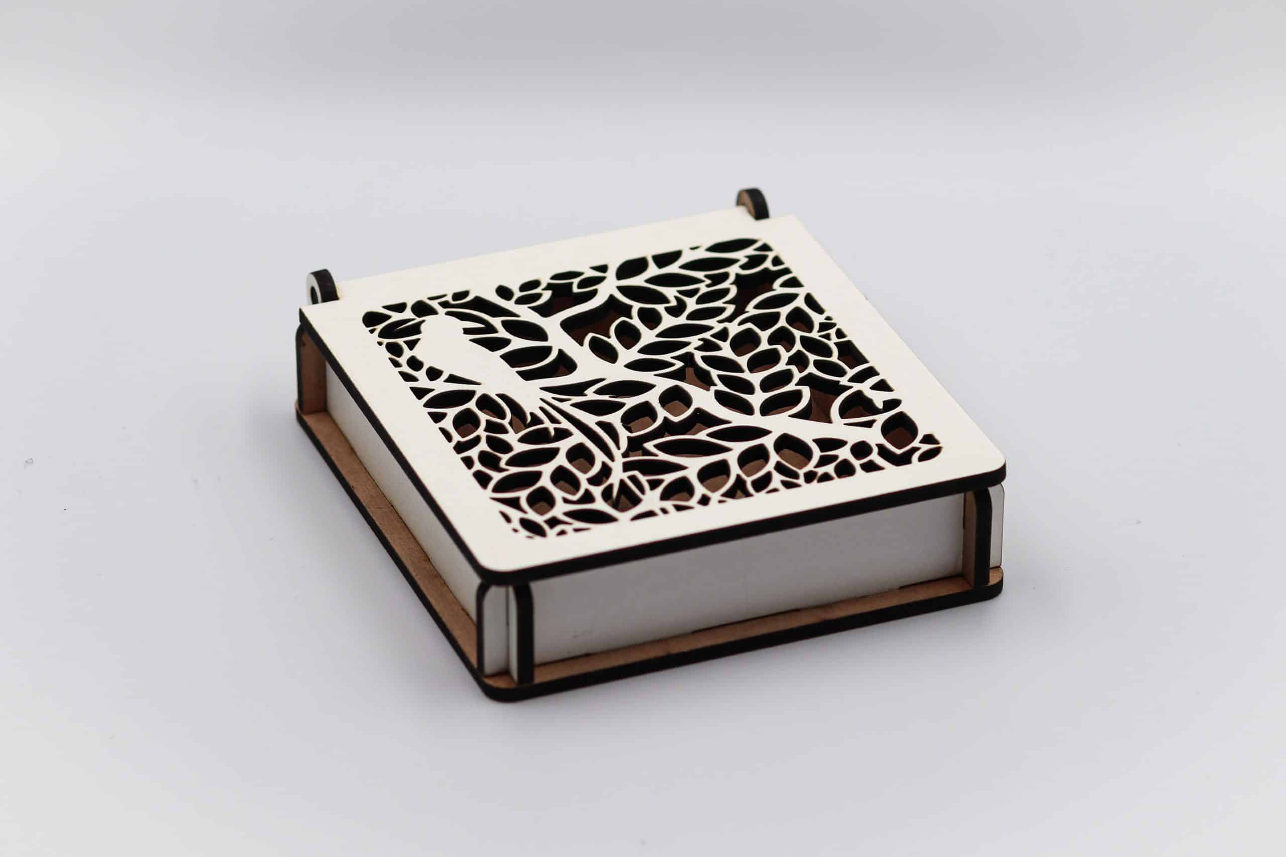 White laminated gift box with bird in tree laser-cut design