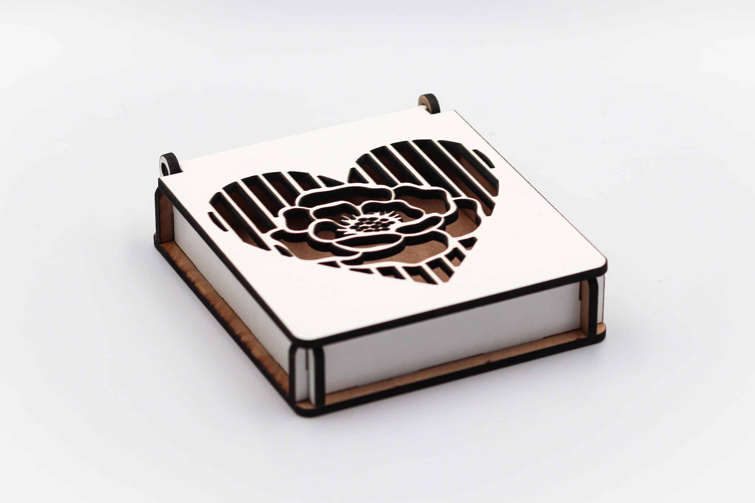 White wooden gift box with floral heart cutout design on lid