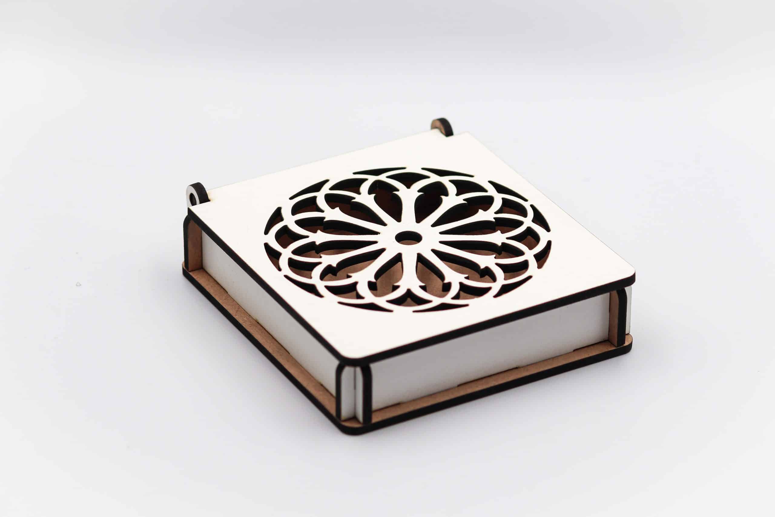 White laser-cut floral pattern gift box with wooden base