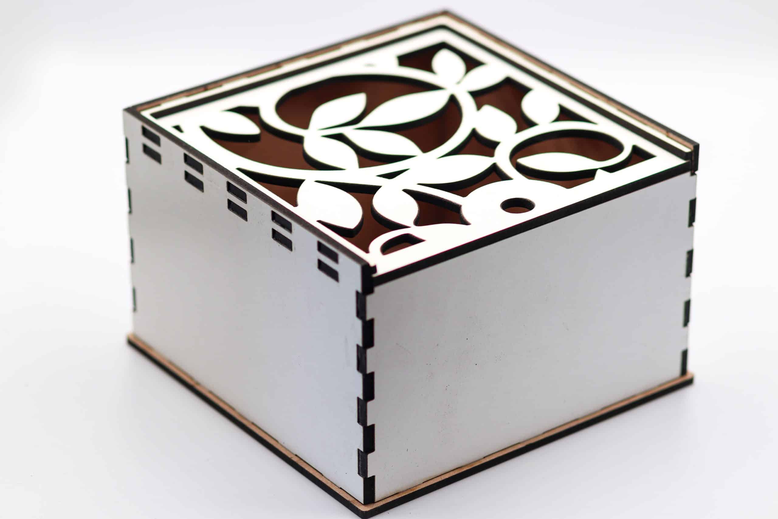 Closed wooden gift box with floral laser-cut lid design