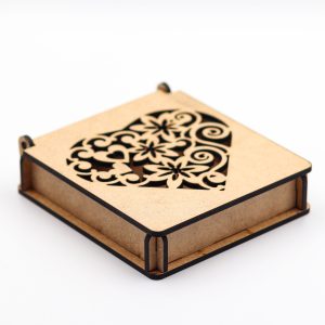 Wooden gift box with intricate laser-cut heart design on lid